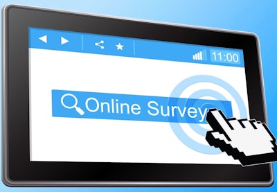 Digital hand on computer screen with 'Online Survey'on it