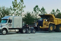 Tractor-trailer carrying large truck