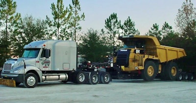 Tractor-trailer carrying large truck