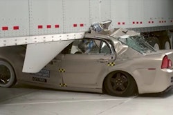 Car crashed under trailer