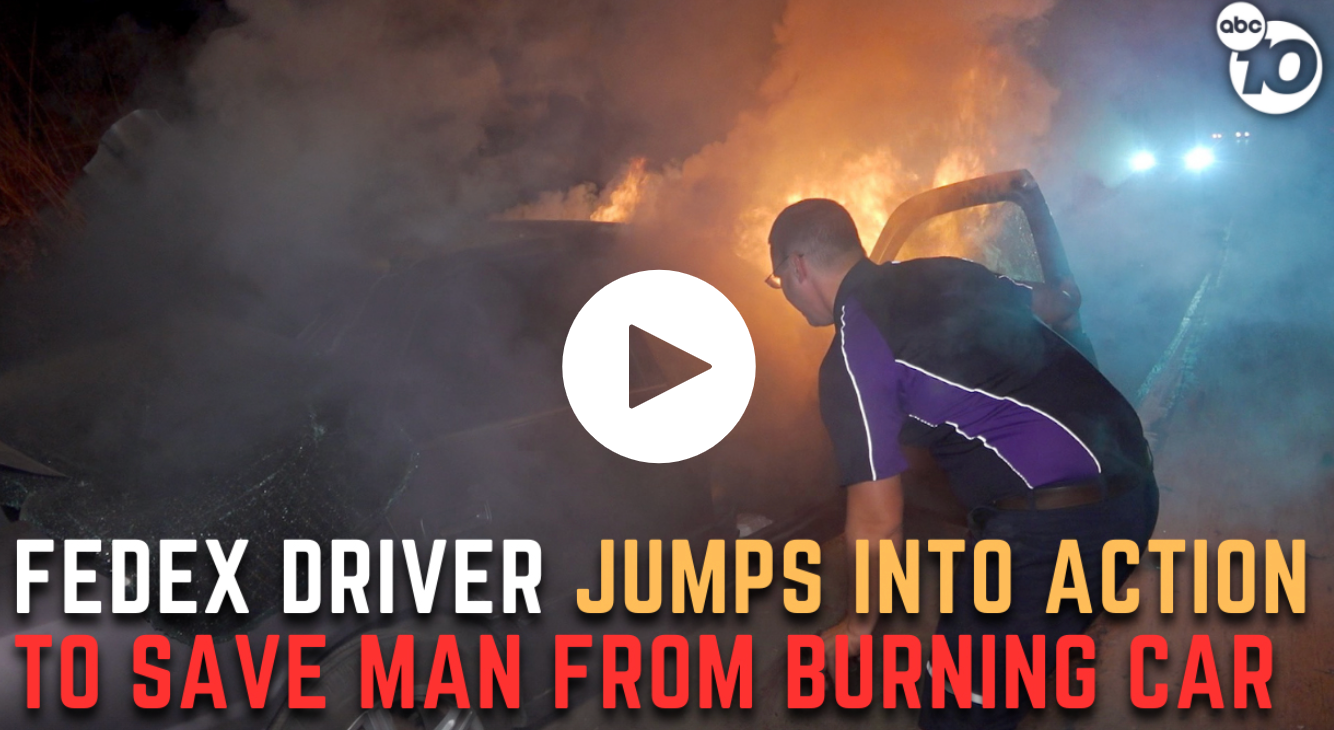 FedEx driver pulls man from burning car