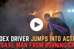 FedEx driver pulls man from burning car