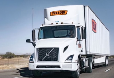 Yellow tractor-trailer on highway