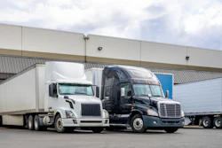 Tractor-trailers being loaded at terminal