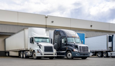 Tractor-trailers being loaded at terminal