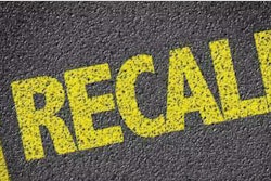 'Recall' painted in yellow on pavement