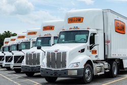 Line of Yellow tractor-trailers