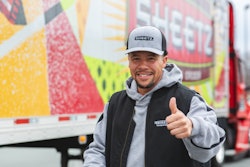 Truck driver in front of Sheetz tractor-trailer