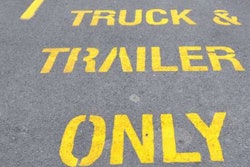 Truck and trailer parking only sign on pavement