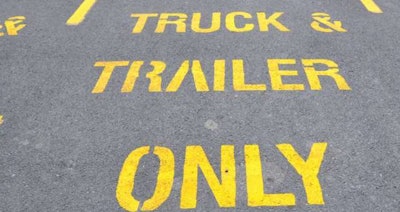 Truck and trailer parking only sign on pavement