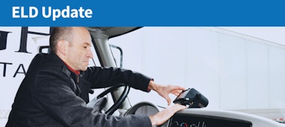 Truck driver adjusting ELD