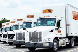 Line of Yellow tractor-trailers