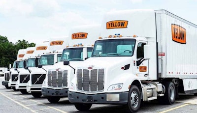 Line of Yellow tractor-trailers