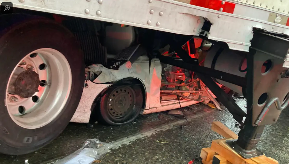 Briefly: Driver survives having their car crushed under big rig’s trailer