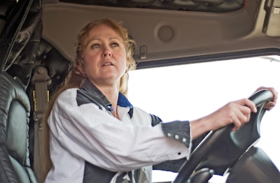 Woman at the wheel of a truck
