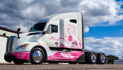 2024 Kenworth T680 with a pink and white wrap in honor of Breast Cancer Awareness month.