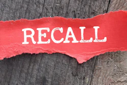 'Recall' in white on red torn paper