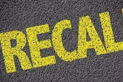 'Recall' painted on pavement in yellow