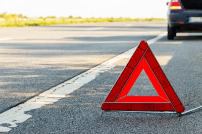 Emergency triangle on side of highway