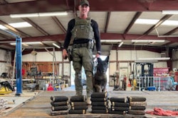 Sgt. Randy Thumann and Kolt with the cocaine they found in the axles of a tractor-trailer