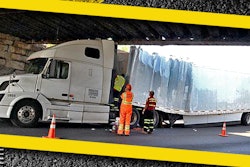 Tractor-trailer strikes overpass