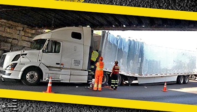 Tractor-trailer strikes overpass