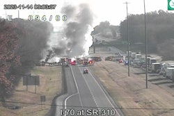 Firefighter at the scene of the collision betwen a charter bus and a tractor-trailer on I-70 in Ohio