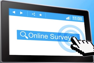 Finger pointing to 'Online Survey' on computer screen