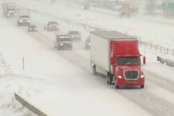 Tractor-trailer on highway in the snow