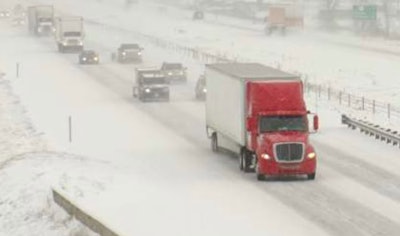 Tractor-trailer on highway in the snow