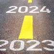 2023 and 2024 painted on highway with yellow stripes