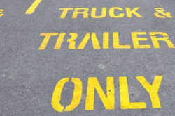 'Truck & Trailer Parking Only' in yellow on pavement
