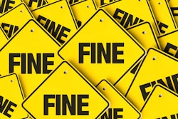 'Fine' in black on yellow highway signs