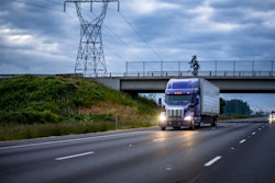 Big rig on highway with overcast sky