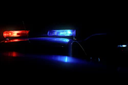 Red and blue police car lights at night