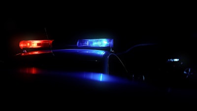 Red and blue police car lights at night