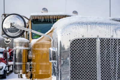 Big rig with ice on the front
