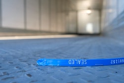 Emptry trailer with broken security seal on the floor