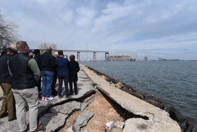 Federal, state and local authorites view the collapsed Francis Scott Key Bridge in Baltimore Harbor