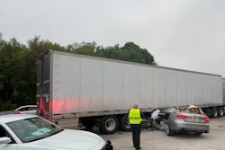 Car wedged under tractor-trailer
