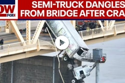Screenshot of truck dangling off bridge