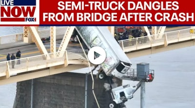 Screenshot of truck dangling off bridge