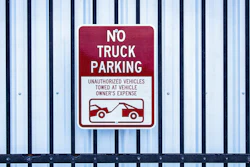 'No Truck Parking' sign on gate