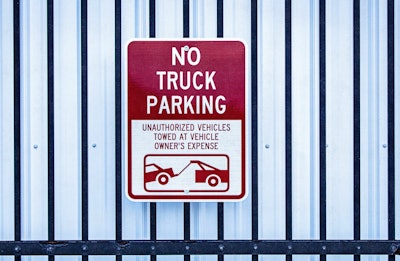 'No Truck Parking' sign on gate