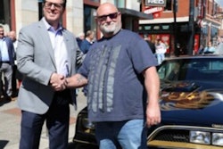 Chuck Ryan, president and CEO of AMBEST presents Stacey Hamilton with they to the vintage Firebird