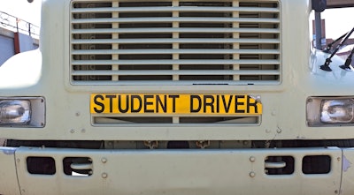 Big rig with 'student Driver' sign on front