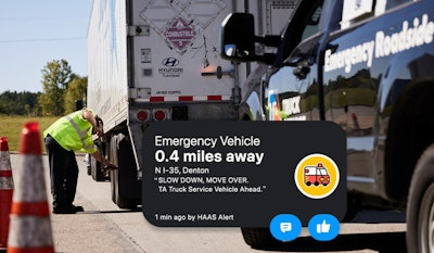 Roadside emergency technician working on tractor-trailer