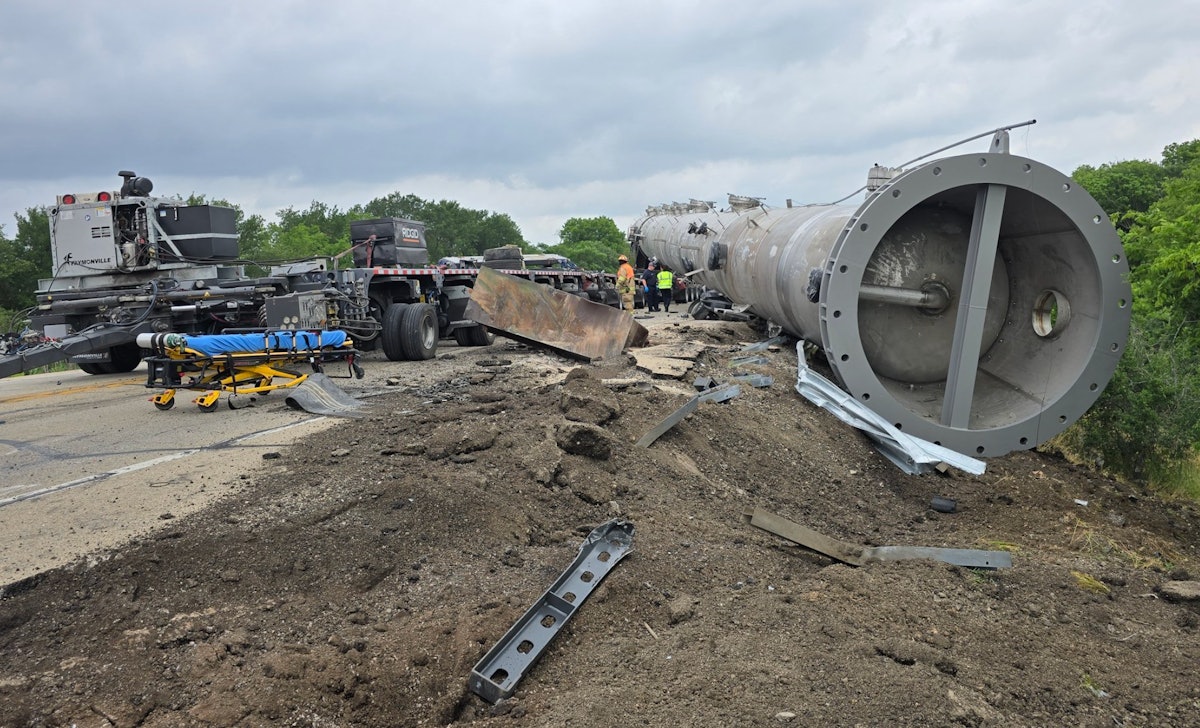 350,000 lb. load falls off trailer, lands on vehicle killing two people