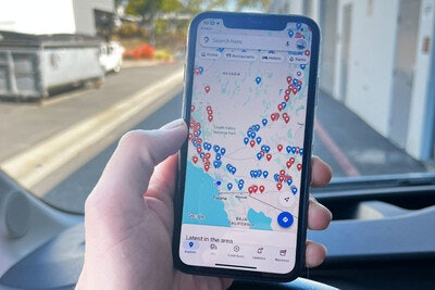 Smartphone showing locations of truck stops with showers