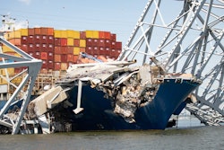 Steel being removed from the containers ship Dali